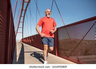 Senior Runner Training On Pedestrian Bridge Stock Photo 1614935809 ...