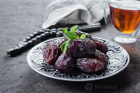 Ramadan kareem. Ramadan Food Concept. Fresh Dates and nuts with rosery ...