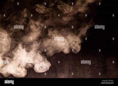 Billowing Cloud Of White Smoke Against Dark Background Stock Photo Alamy