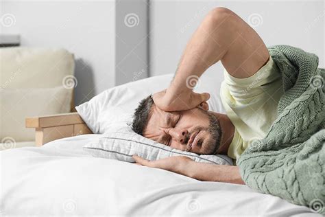 Sleepless Man Lying In Bed At Home Stock Image Image Of Exhausted