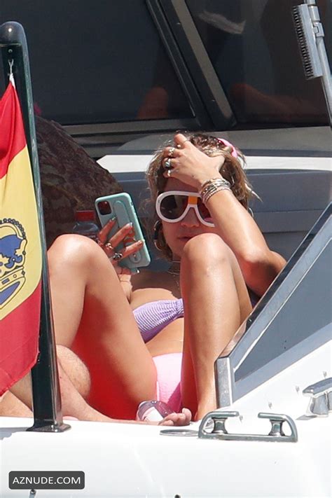 Rita Ora Relaxing On A Boat In Ibiza Spain With Friends In A Purple Bandeau Bikini AZNude