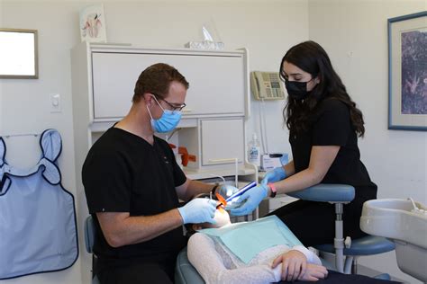 Oakville Dentist Dr Jacobs And Dental Hygienist Performing Root Canal