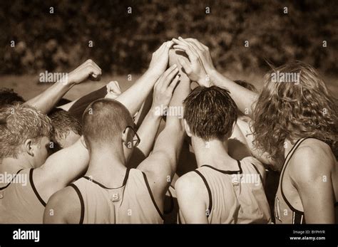 "Teamwork" - athletes pulling together as a team Stock Photo - Alamy