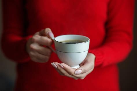 Premium Photo A Cup Of Hot Coffee In Female Hands Concept Drinks Lifestyle Work Background
