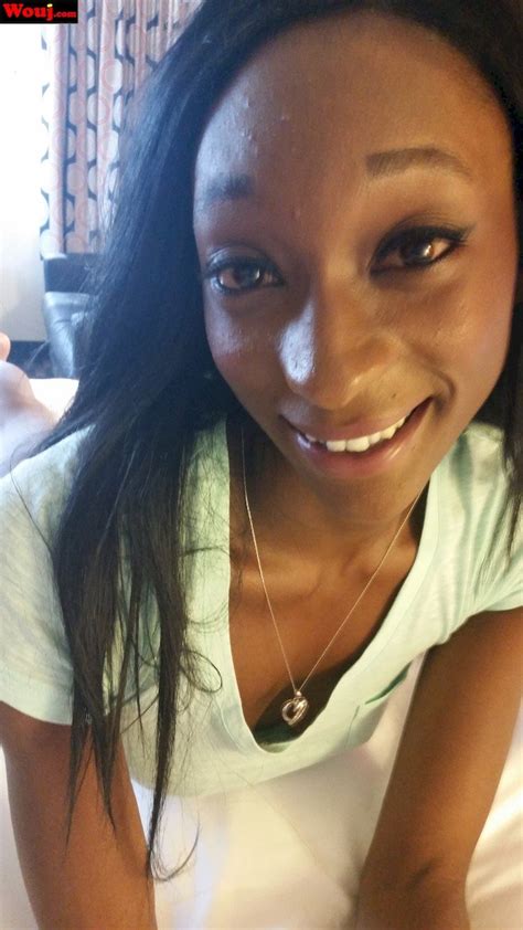 Hot Black Babe Posing In A Black Top In The Bedroom Photos