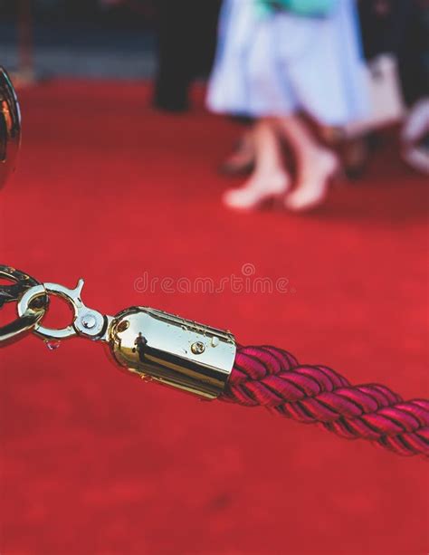 Red Carpet With Ropes And Golden Barriers On A Luxury Party Entrance