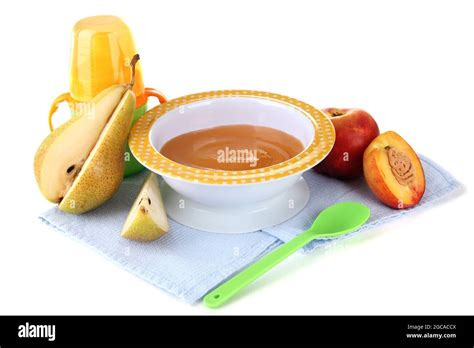 Tasty baby fruit puree and baby bottle isolated on white Stock Photo