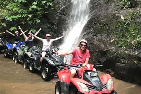 Atv Quad Bike Through Tunnel And Waterfall In Bali