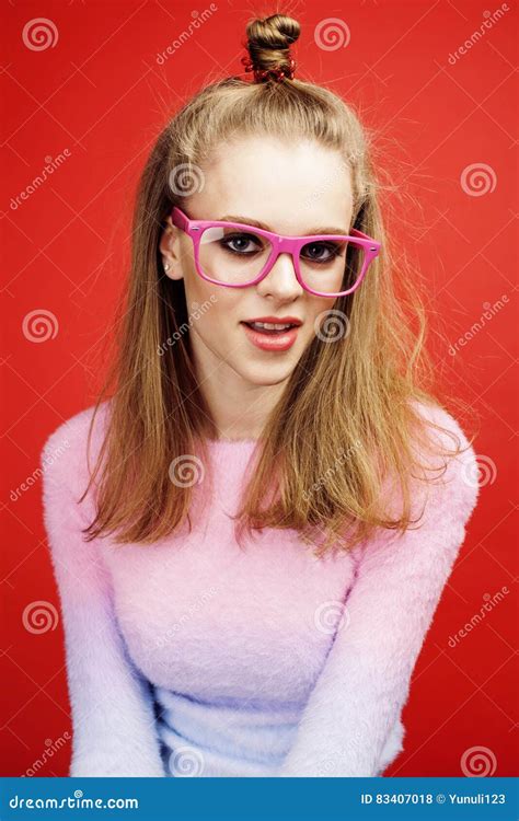 Young Pretty Emitonal Posing Teenage Girl On Bright Red Background