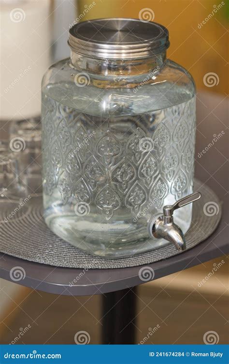 Homemade Glass Water Container Stands On The Table The Container Has A