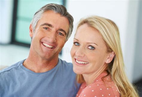 Devoted To Each Other Portrait Of A Loving Mature Couple At Home Stock Image Image Of Blonde