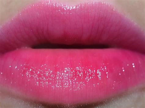 A Woman S Lips With Pink And White Glitter On Them