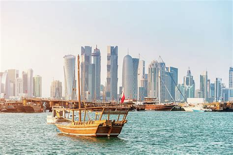 Traditional Dhows In Front Of Modern by Mlenny