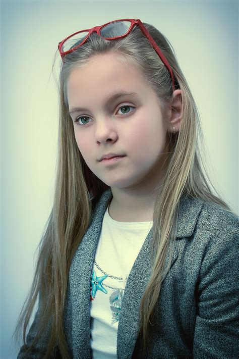 cute-young-girl-portrait-with-sunglasses-above-face image - Free stock