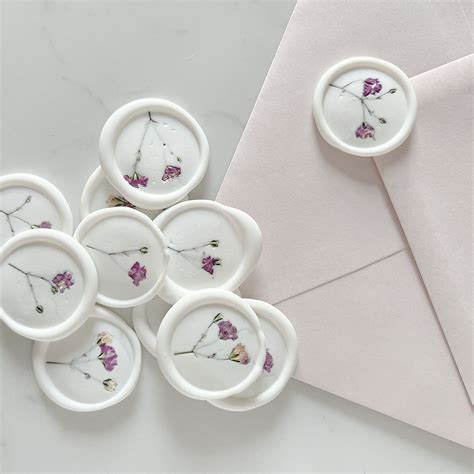 White Wax Seals With Dried Pink Gypsophila Flowers