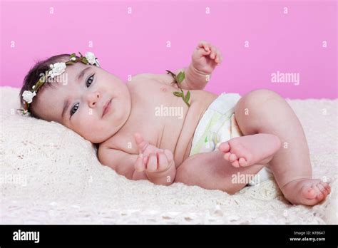 Cute Pretty Happy Chubby Baby Girl Naked Or Nude With Diaper Or Nappy On A Fluffy Blanket