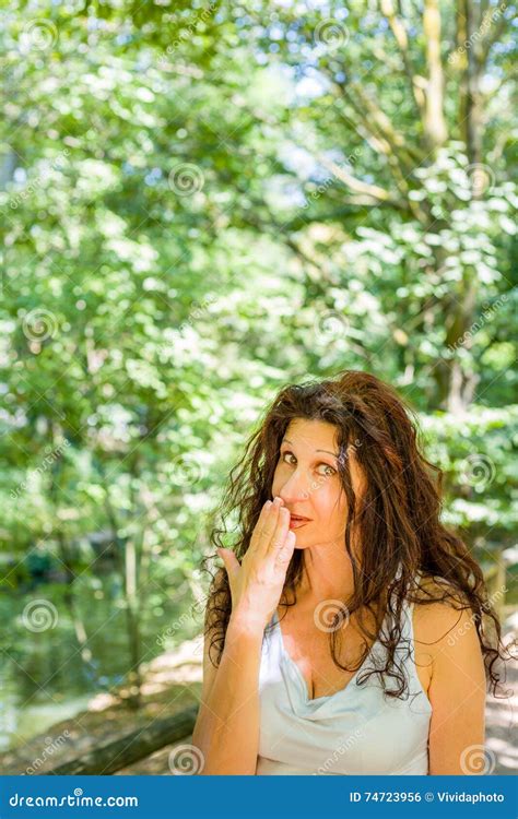 Busty Classy Mature Woman Covering Her Mouth Stock Photo Image Of Space Gesture 74723956