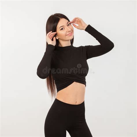 Pretty Woman In Black Suit Close Up Portrait Of Sporty Beautiful Female Body Tanned Brunette