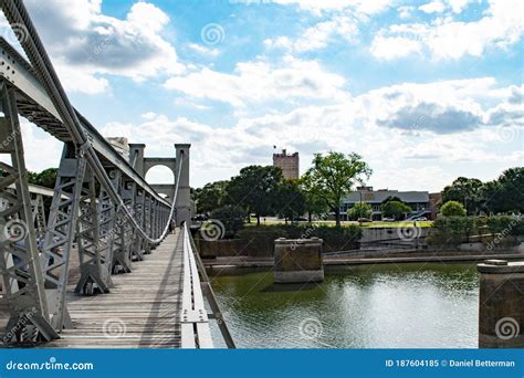 brazos river running  wacos iconic suspension bridge stock image