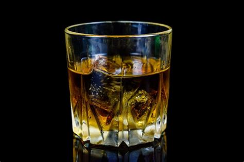 Premium Photo Glass Of Whiskey Isolated On The Black Background