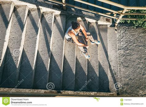 Woman Rests On The Stairs After Workout Exercises Stock Image Image