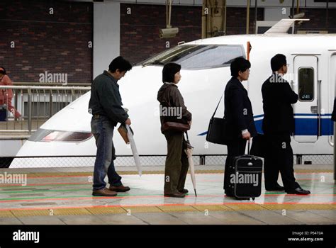 Passengers Waiting To Board Bullet Train At Tokyo Station Japan Stock