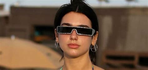 Dua Lipa Wore A Thong Bikini Underneath A Sheer Coverup That Featured A Massive Midriff Cutout
