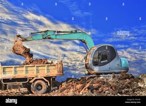 Excavator Loading Dumper Truck Tipper In Sandpit Stock Photo Alamy