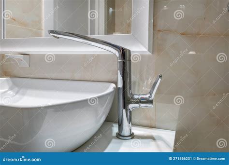 Metal Water Tap With Sink And Faucet To Turn On And Regulate Cold Or Hot Water In Expensive