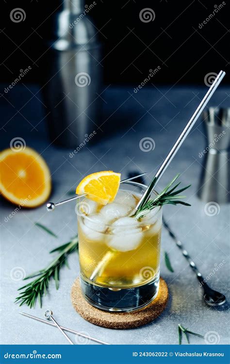 Alcohol Cocktail With Orange Slice Rosemary Ice And Shaker Jigger On Black Background Party