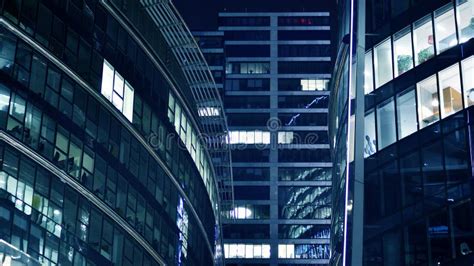 Pattern Of Office Buildings Windows Illuminated At Night Stock Photo