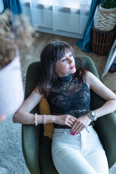 Perfect Brunette Woman With Perfect Skin Big Full Lips Posing At Bedroom Wearing Top Stock