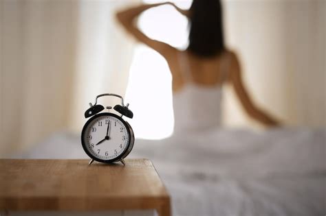 Premium Photo Woman Stretching Hands In Bed After Wake Up Sun Flare Brunette Entering A Day