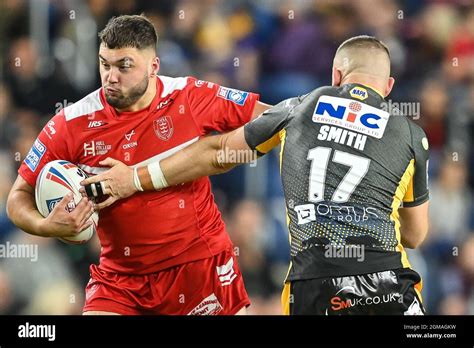 Matty Storton 18 Of Hull KR Evades The Tackle Of Cameron Smith 17