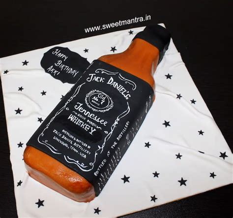 A Hot Dog In A Bottle On Top Of A Cake