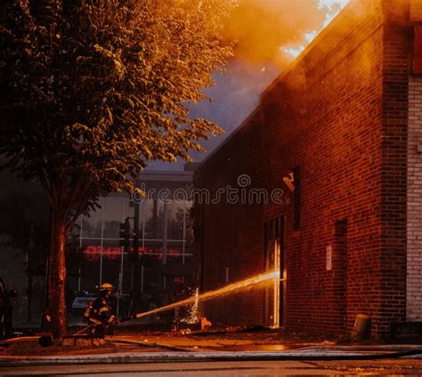 Firefighter Extinguishing a Fire during the George Floyd Riots of 2020 ...