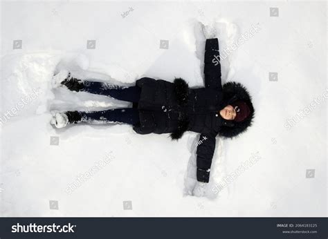 Happy Girl Lying On Snow Wintertime Stock Photo 2064183125 | Shutterstock