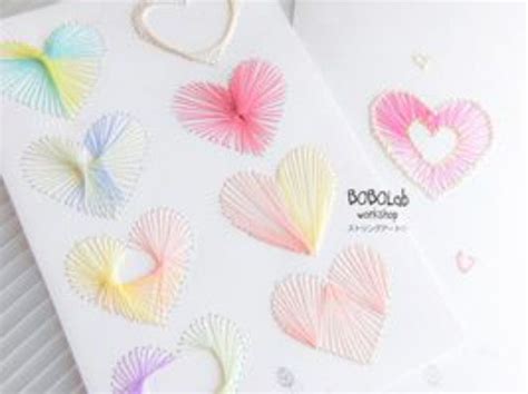 Some Paper Hearts Are On Top Of A White Card With The Words Boobobab