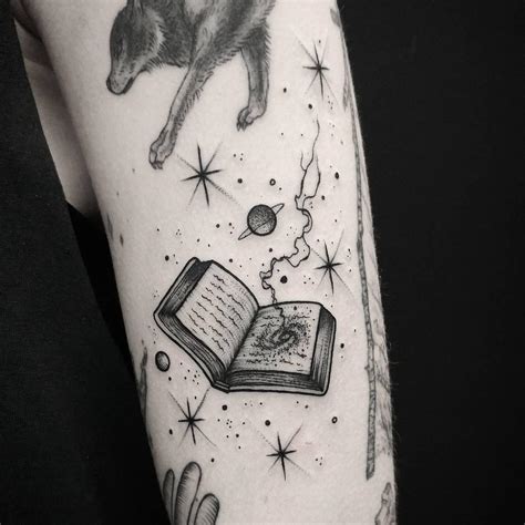 Spellbook by @thomasetattoos - Tattoogrid.net