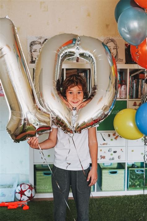 Birthday boy 10 years with balloons in his teen room Stock Photo by ...