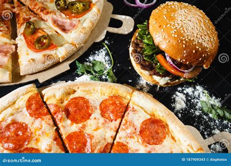 Pizza And Burger On A Black Background Top View Stock Image Image Of