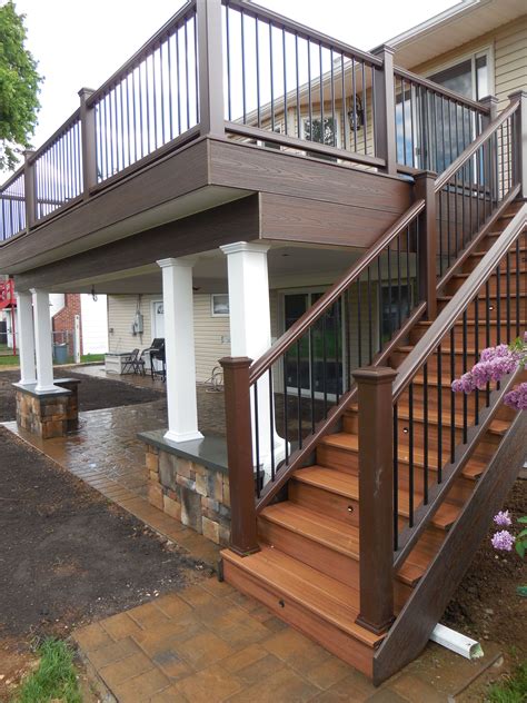 Second Floor Trex Deck With Custom Columns On Stone Walls Patio Deck