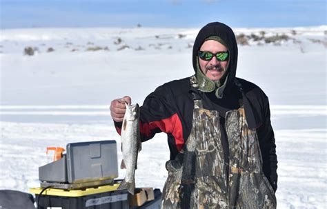 Wolford Ice Fishing Catching Brown Trout On A Bluebird Day