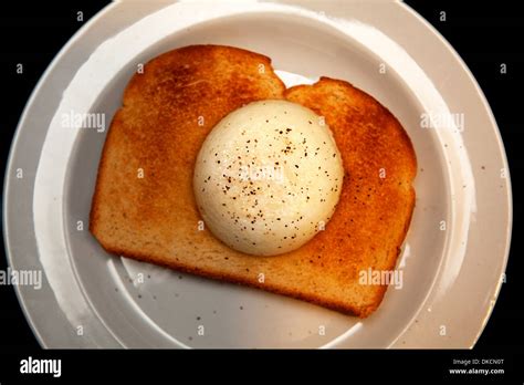 Poached egg on toast Stock Photo - Alamy