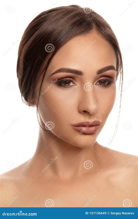 Close Up Portrait Of A Brunette Nude Model Girl With Professional Evening Make Up And Plump Lips