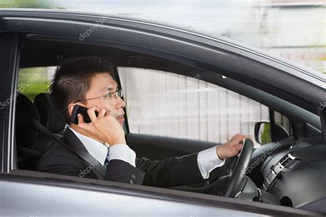 Talking on phone while driving Stock Photo by ©OtnaYdur 10741658