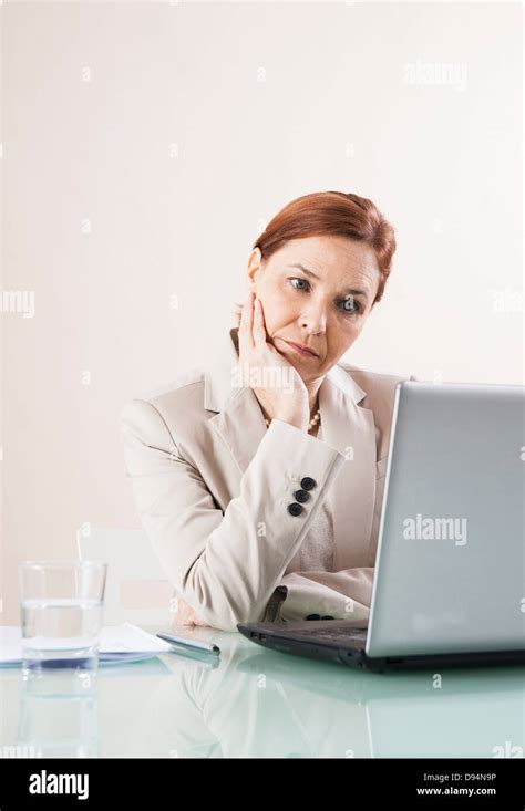 Mature Woman Working On Laptop In Office Stock Photo Alamy