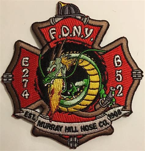 A Fire Department Patch With A Dragon On Its Back And The Words Fdny