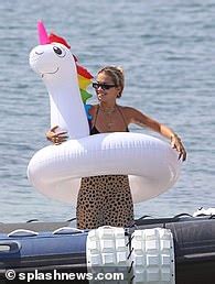 Rita Ora Struggles To Contain Her Ample Assets As She Rocks A TINY Black Bikini In Ibiza Daily