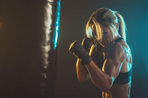 Premium Photo Concentrated Woman Doing A Fitness Boxing Workout With